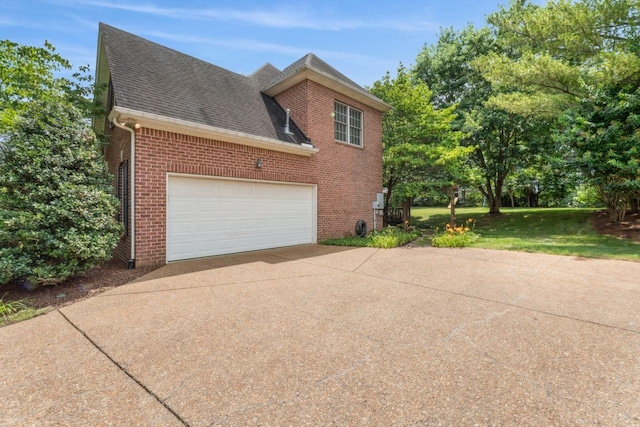 7125 Locksley Ln, Fairview, TN 37062 - view of side of property with concrete driveway, brick siding, a shingled roof, a lawn, and a garage