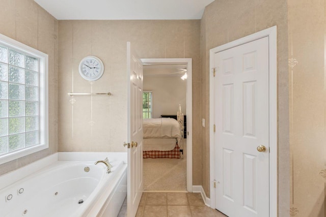 7125 Locksley Ln, Fairview, TN 37062 - ensuite bathroom featuring a tub with jets and tile patterned flooring