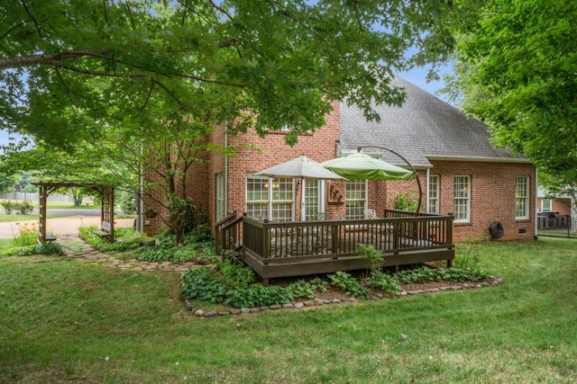 7125 Locksley Ln, Fairview, TN 37062 - back of house featuring brick siding, a deck, a yard, and a shingled roof