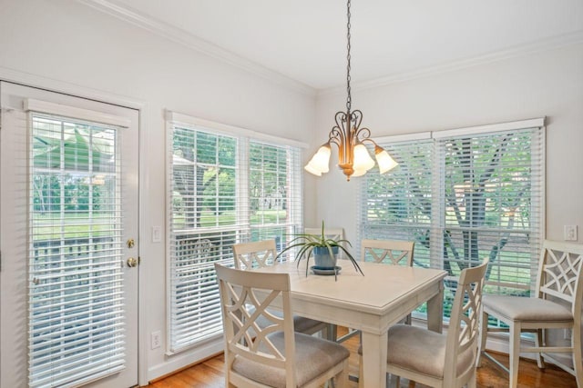 7125 Locksley Ln, Fairview, TN 37062 - dining area featuring a chandelier, crown molding, and light wood-style floors