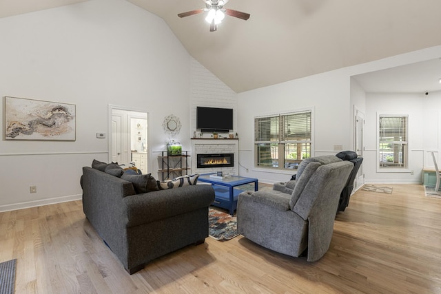 29 Harbor Pt, Lebanon, TN 37087 - living room with a glass covered fireplace, high vaulted ceiling, a ceiling fan, and light wood finished floors
