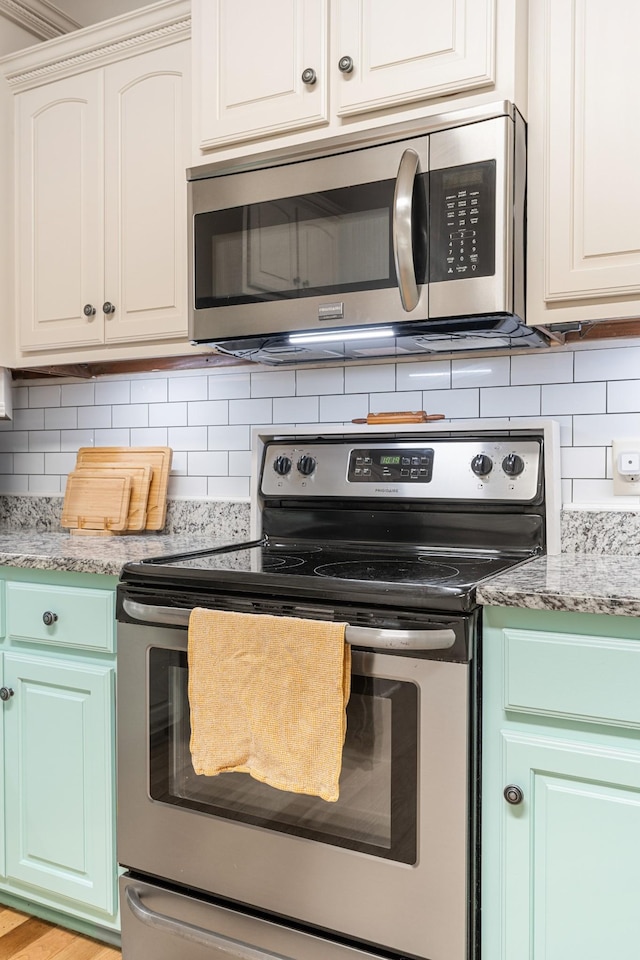 29 Harbor Pt, Lebanon, TN 37087 - kitchen with appliances with stainless steel finishes and decorative backsplash