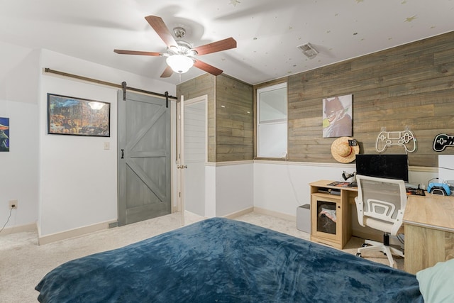 29 Harbor Pt, Lebanon, TN 37087 - bedroom featuring a barn door, wood walls, carpet, a desk, and ceiling fan