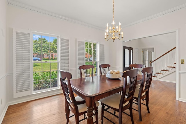 513 Foxcroft Cir, Franklin, TN 37067 - dining room with ornamental molding, plenty of natural light, a chandelier, light wood-style flooring, and stairway