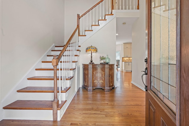 513 Foxcroft Cir, Franklin, TN 37067 - foyer with light wood-style floors, a towering ceiling, and stairs