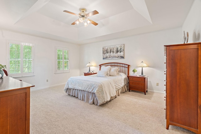 513 Foxcroft Cir, Franklin, TN 37067 - bedroom featuring a raised ceiling, light colored carpet, and a ceiling fan