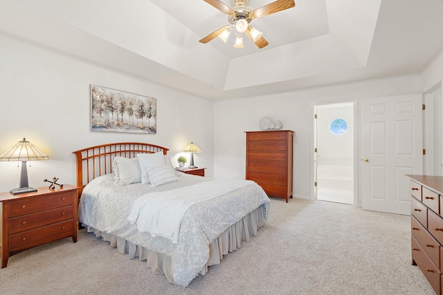 513 Foxcroft Cir, Franklin, TN 37067 - bedroom with light colored carpet, a tray ceiling, ensuite bathroom, and ceiling fan