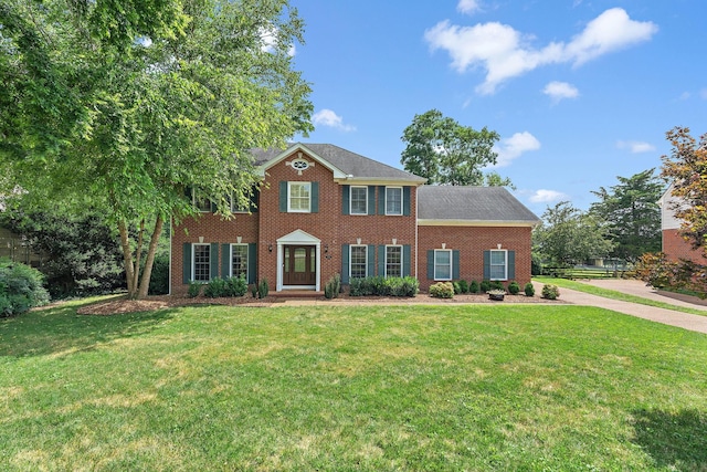 513 Foxcroft Cir, Franklin, TN 37067 - colonial-style house featuring a front yard and brick siding