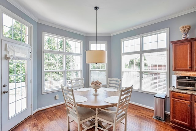 3045 Sakari Cir, Spring Hill, TN 37174 - dining space with plenty of natural light, wood finished floors, and crown molding