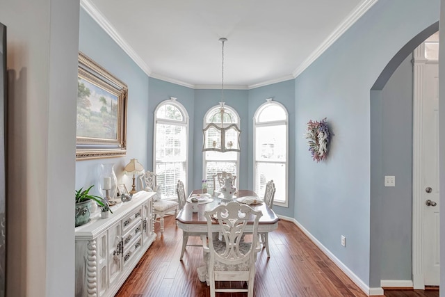 3045 Sakari Cir, Spring Hill, TN 37174 - dining room featuring arched walkways, dark wood-style flooring, and crown molding