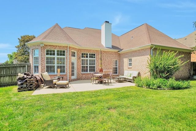 3045 Sakari Cir, Spring Hill, TN 37174 - rear view of property with brick siding, a chimney, a patio, and a shingled roof