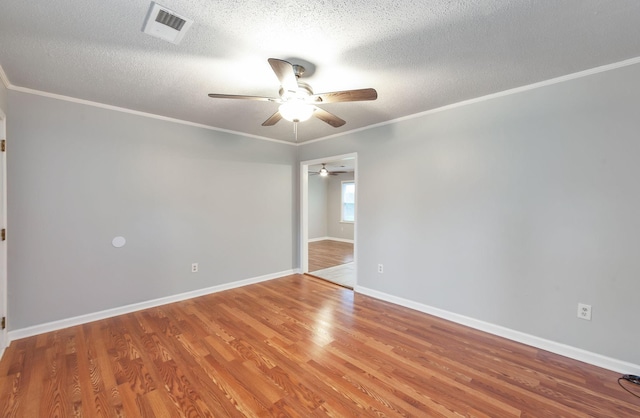 274 Spring Hill Rd, Stanton, TN 38069 - empty room with a ceiling fan, wood finished floors, a textured ceiling, and ornamental molding