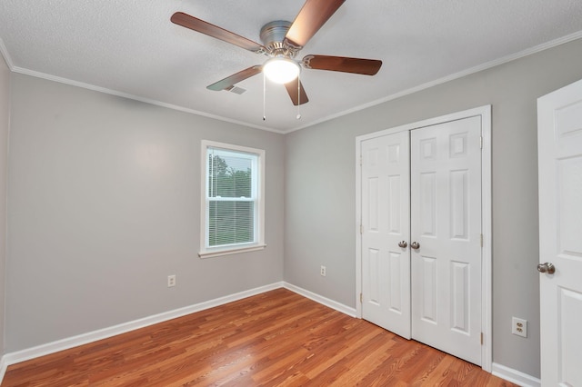 274 Spring Hill Rd, Stanton, TN 38069 - unfurnished bedroom with light wood finished floors, a closet, crown molding, a ceiling fan, and a textured ceiling