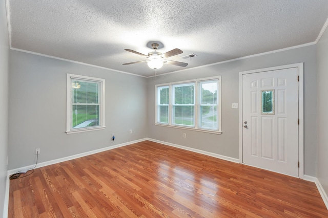 274 Spring Hill Rd, Stanton, TN 38069 - entryway featuring ceiling fan, wood finished floors, a textured ceiling, and crown molding