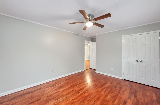 274 Spring Hill Rd, Stanton, TN 38069 - unfurnished bedroom featuring wood finished floors, ornamental molding, a closet, and a ceiling fan