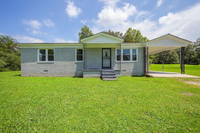 274 Spring Hill Rd, Stanton, TN 38069 - view of front facade with brick siding, a carport, crawl space, and a front yard