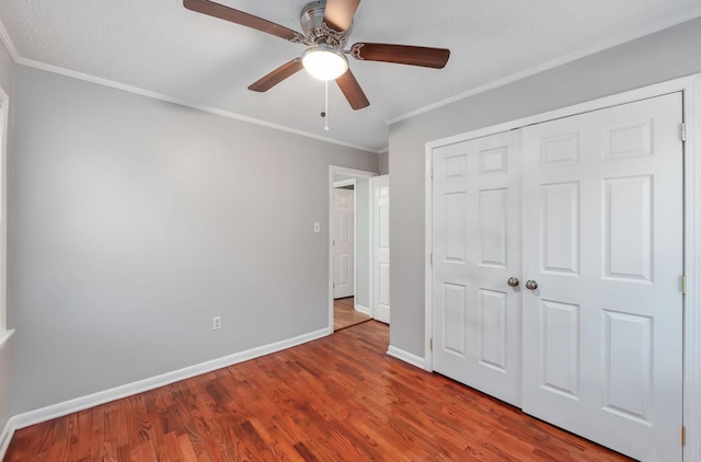 274 Spring Hill Rd, Stanton, TN 38069 - unfurnished bedroom featuring wood finished floors, crown molding, a closet, and ceiling fan