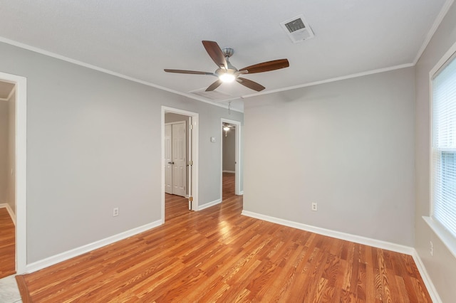 274 Spring Hill Rd, Stanton, TN 38069 - unfurnished bedroom with light wood-type flooring, crown molding, multiple windows, and ceiling fan