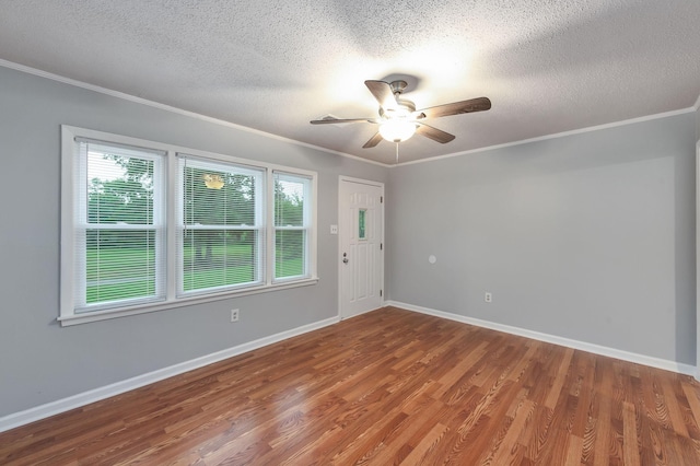 274 Spring Hill Rd, Stanton, TN 38069 - spare room featuring a textured ceiling, wood finished floors, ceiling fan, and crown molding