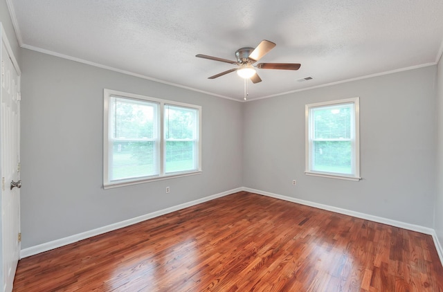 274 Spring Hill Rd, Stanton, TN 38069 - empty room with healthy amount of natural light, wood finished floors, ceiling fan, crown molding, and a textured ceiling