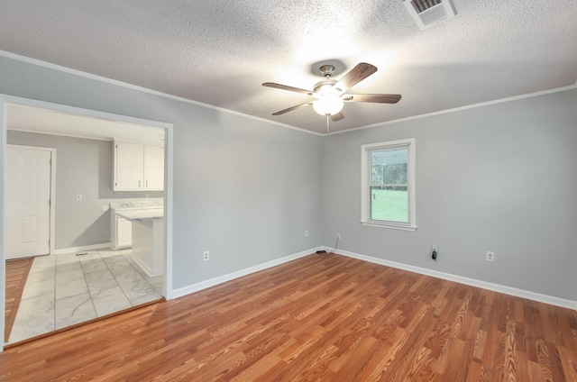 274 Spring Hill Rd, Stanton, TN 38069 - spare room featuring ceiling fan, crown molding, a textured ceiling, and light wood-type flooring