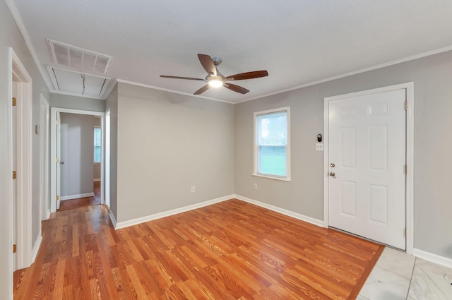 274 Spring Hill Rd, Stanton, TN 38069 - foyer entrance with healthy amount of natural light, a ceiling fan, light wood finished floors, and crown molding