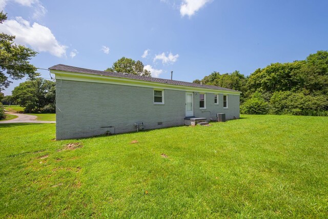 274 Spring Hill Rd, Stanton, TN 38069 - back of house featuring crawl space, a lawn, and brick siding
