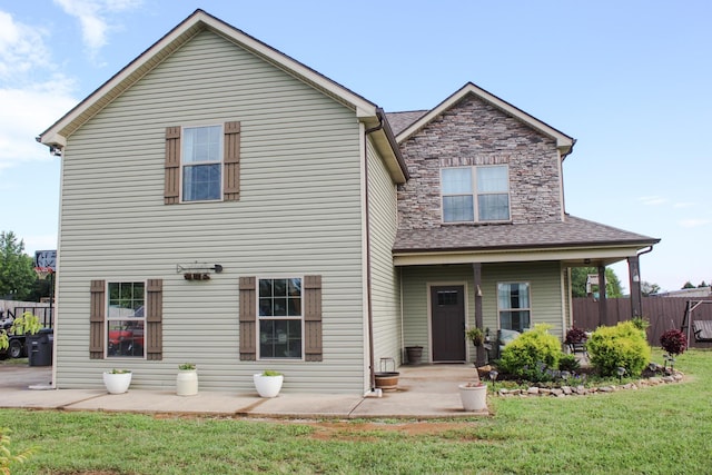 2210 Indian Mound Rd, Woodlawn, TN 37191 - rear view of house with a patio area and roof with shingles