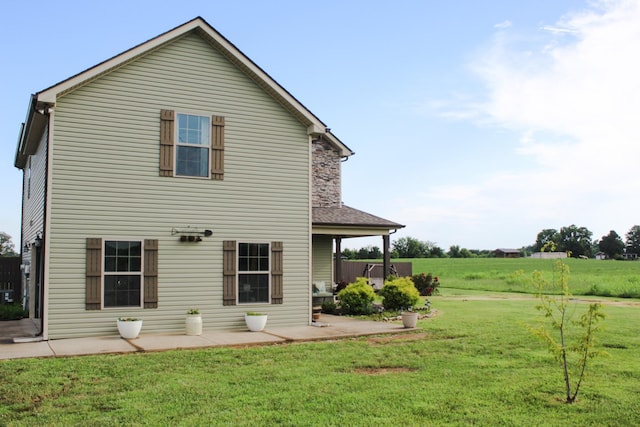 2210 Indian Mound Rd, Woodlawn, TN 37191 - rear view of house featuring a patio and a yard