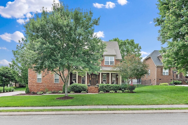 1011 Glessner Dr, Spring Hill, TN 37174 - obstructed view of property with brick siding and a front lawn
