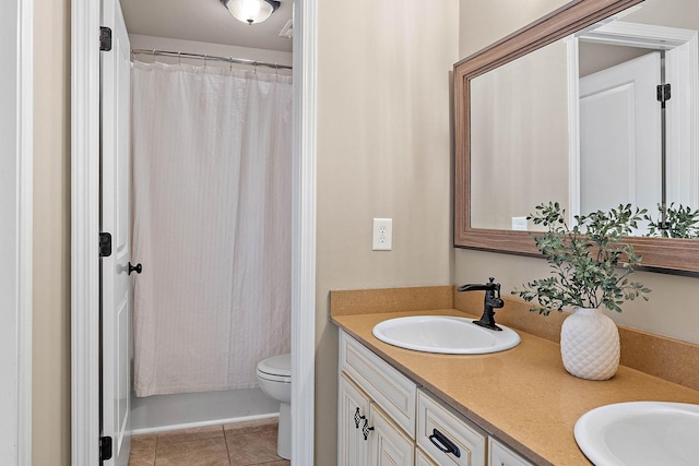 1011 Glessner Dr, Spring Hill, TN 37174 - bathroom with double vanity, tile patterned floors, and a shower with shower curtain