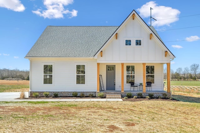 1894 Hamilton Chambers Rd, Lebanon, TN 37087 - modern farmhouse featuring board and batten siding, a porch, roof with shingles, and a front yard