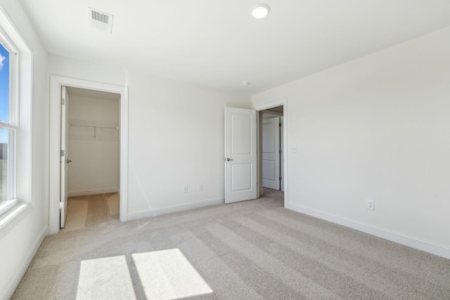 1894 Hamilton Chambers Rd, Lebanon, TN 37087 - unfurnished bedroom with light colored carpet and a walk in closet