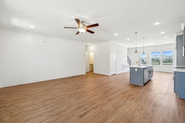 1894 Hamilton Chambers Rd, Lebanon, TN 37087 - kitchen featuring a ceiling fan, light countertops, light wood-style floors, decorative light fixtures, and crown molding