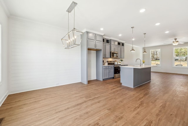 1894 Hamilton Chambers Rd, Lebanon, TN 37087 - kitchen featuring stainless steel appliances, gray cabinets, open floor plan, recessed lighting, and light wood-type flooring