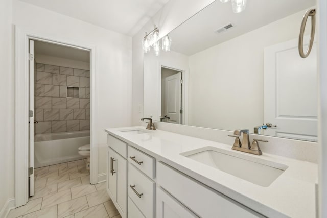 1894 Hamilton Chambers Rd, Lebanon, TN 37087 - bathroom featuring marble look tile flooring, double vanity, and shower / bathtub combination