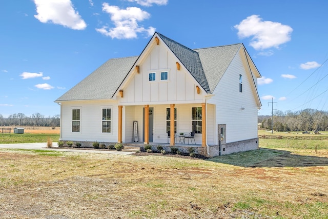 1894 Hamilton Chambers Rd, Lebanon, TN 37087 - modern farmhouse with board and batten siding, covered porch, a shingled roof, and a front yard