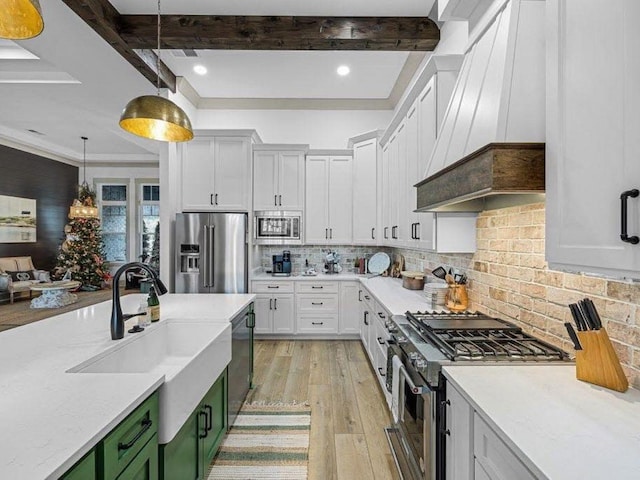 25 Shoreview Ln, Huntingdon, TN 38344 - kitchen featuring stainless steel appliances, custom exhaust hood, light wood finished floors, green cabinets, and beam ceiling