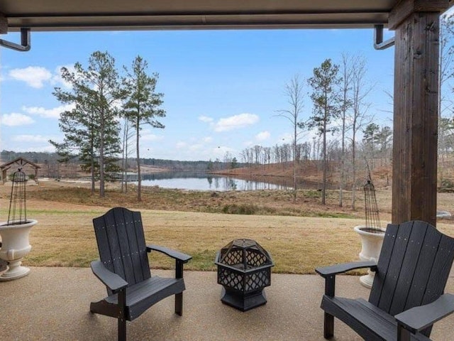 25 Shoreview Ln, Huntingdon, TN 38344 - view of patio / terrace featuring a water view and a fire pit