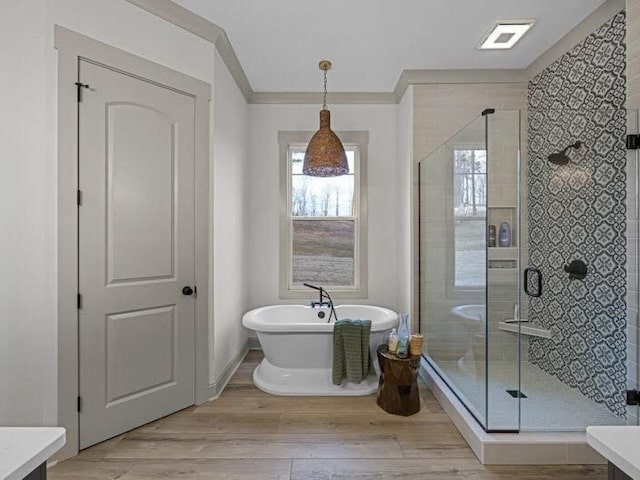 25 Shoreview Ln, Huntingdon, TN 38344 - full bathroom with a freestanding tub, a stall shower, wood finished floors, ornamental molding, and vanity