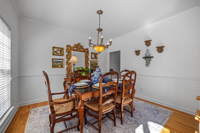 7767 Lynnle Way, Hixson, TN 37343 - dining space with a chandelier, crown molding, light wood-style floors, and plenty of natural light