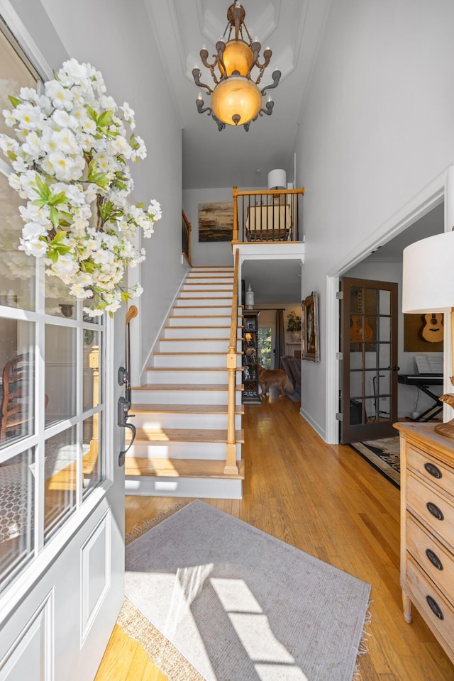 7767 Lynnle Way, Hixson, TN 37343 - foyer featuring stairs, a high ceiling, hardwood / wood-style flooring, and a chandelier