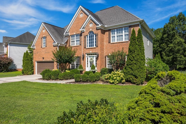 7767 Lynnle Way, Hixson, TN 37343 - view of front facade with brick siding, an attached garage, concrete driveway, a front yard, and roof with shingles