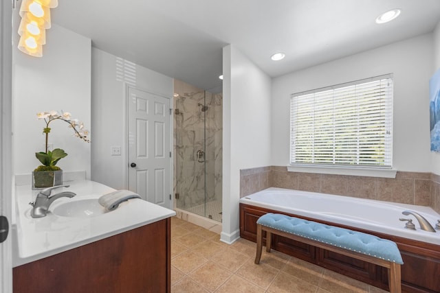 7767 Lynnle Way, Hixson, TN 37343 - bathroom featuring a garden tub, a shower stall, vanity, tile patterned floors, and recessed lighting