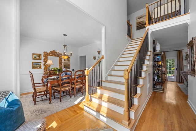 7767 Lynnle Way, Hixson, TN 37343 - staircase with hardwood / wood-style floors, a chandelier, and crown molding