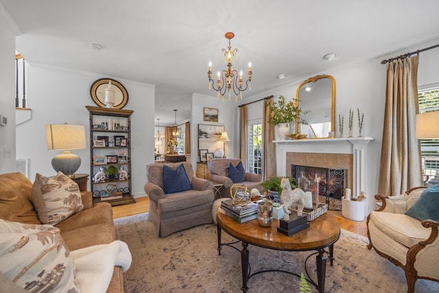 7767 Lynnle Way, Hixson, TN 37343 - living area with a chandelier, plenty of natural light, wood finished floors, and crown molding