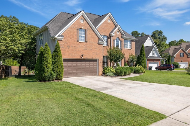 7767 Lynnle Way, Hixson, TN 37343 - traditional-style home with brick siding, concrete driveway, and a garage