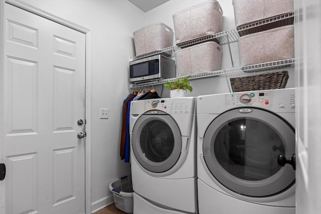 7767 Lynnle Way, Hixson, TN 37343 - laundry room with washer and clothes dryer and baseboards