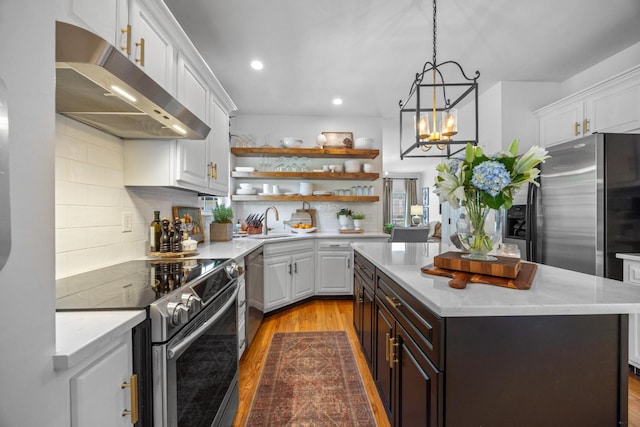 7767 Lynnle Way, Hixson, TN 37343 - kitchen with stainless steel appliances, under cabinet range hood, white cabinets, wood finished floors, and recessed lighting