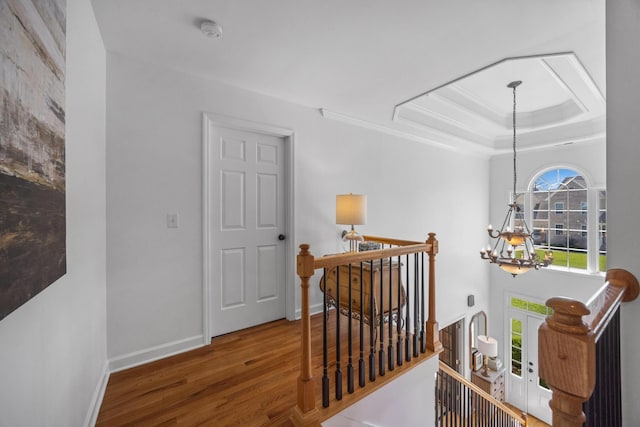 7767 Lynnle Way, Hixson, TN 37343 - corridor featuring an upstairs landing, a chandelier, wood finished floors, crown molding, and a raised ceiling